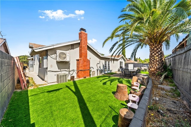 18536 Mescal St, Rowland Heights, CA 91748 - back of house with a chimney, a fenced backyard, stucco siding, and a patio