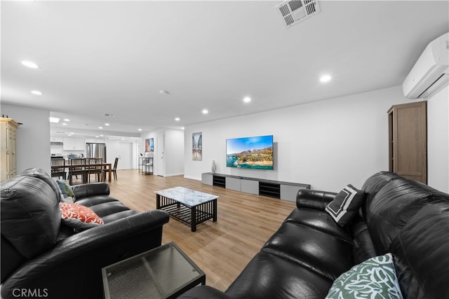 18536 Mescal St, Rowland Heights, CA 91748 - living area with a wall mounted air conditioner, recessed lighting, and light wood-style floors