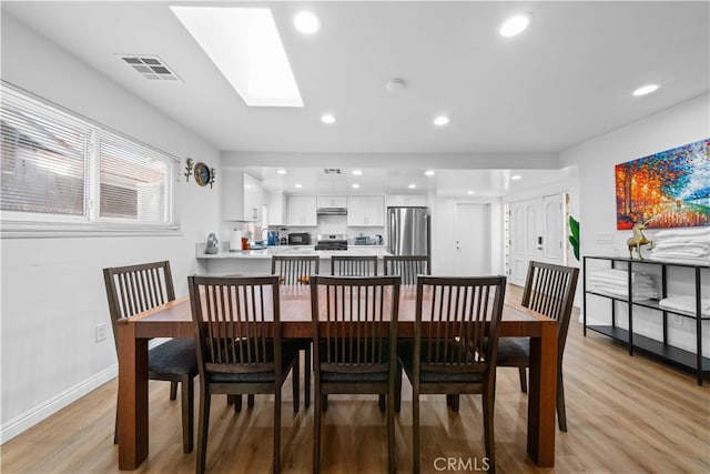 18536 Mescal St, Rowland Heights, CA 91748 - dining room featuring light wood-style flooring, recessed lighting, and a skylight