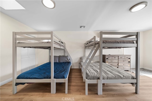 18536 Mescal St, Rowland Heights, CA 91748 - bedroom featuring wood finished floors and a skylight