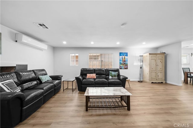 18536 Mescal St, Rowland Heights, CA 91748 - living area with light wood-style flooring, recessed lighting, a wall unit AC, and healthy amount of natural light