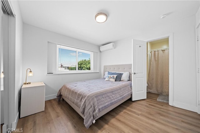 18536 Mescal St, Rowland Heights, CA 91748 - bedroom featuring a wall unit AC and light wood finished floors