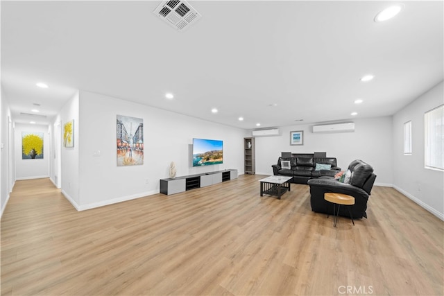 18536 Mescal St, Rowland Heights, CA 91748 - living room with recessed lighting, a wall unit AC, a wall mounted air conditioner, and light wood-style floors
