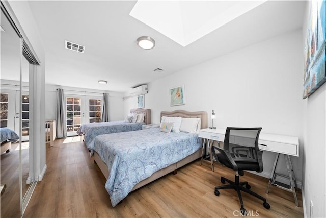 18536 Mescal St, Rowland Heights, CA 91748 - bedroom with french doors, wood finished floors, a skylight, and an office area