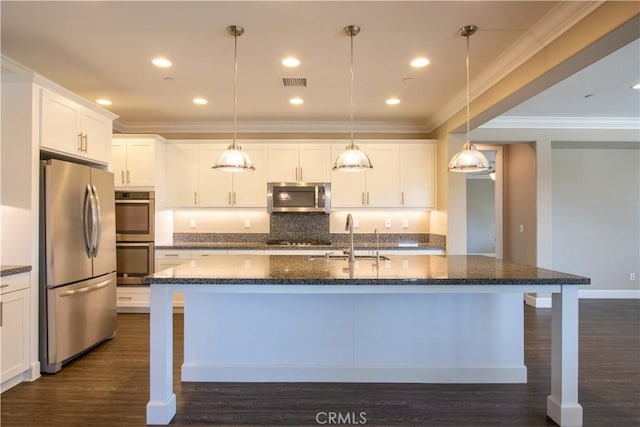 27974 Garda Ct, Menifee, CA 92585 - kitchen featuring stainless steel appliances, dark wood finished floors, crown molding, a kitchen island with sink, and white cabinetry