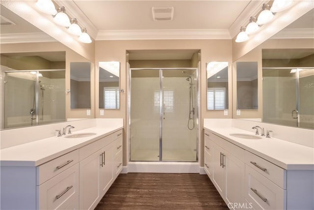 27974 Garda Ct, Menifee, CA 92585 - full bath with a stall shower, two vanities, wood finished floors, and crown molding
