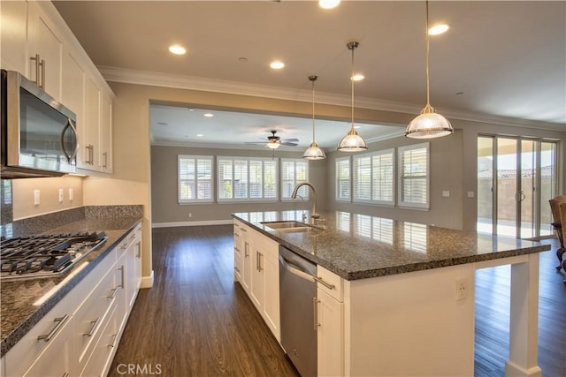 27974 Garda Ct, Menifee, CA 92585 - kitchen featuring stainless steel appliances, dark wood-style flooring, ceiling fan, ornamental molding, and white cabinets
