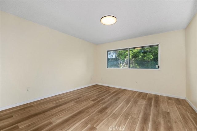 2321 S Magnolia Ave Unit 6E, Ontario, CA 91762 - empty room with light wood finished floors and baseboards