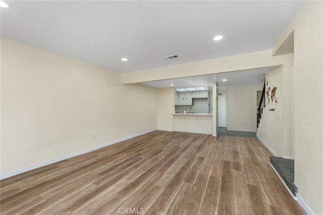 2321 S Magnolia Ave Unit 6E, Ontario, CA 91762 - unfurnished living room with wood finished floors and recessed lighting