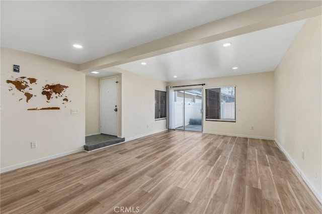 2321 S Magnolia Ave Unit 6E, Ontario, CA 91762 - unfurnished living room with light wood-type flooring and recessed lighting