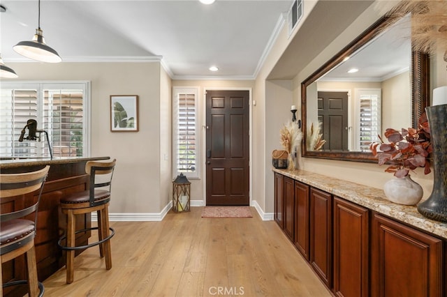 14131 Apple Grove Ct, Eastvale, CA 92880 - entrance foyer featuring healthy amount of natural light, light wood-style flooring, recessed lighting, and crown molding