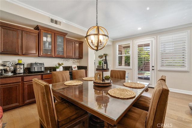 14131 Apple Grove Ct, Eastvale, CA 92880 - dining room featuring a chandelier, crown molding, light wood-type flooring, and recessed lighting