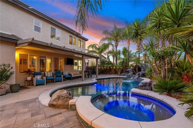 14131 Apple Grove Ct, Eastvale, CA 92880 - view of pool featuring an outdoor living space, a patio area, a fenced backyard, and a pool with connected hot tub