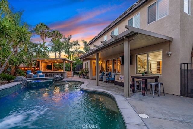 14131 Apple Grove Ct, Eastvale, CA 92880 - view of swimming pool with a patio, outdoor lounge area, and a pool with connected hot tub