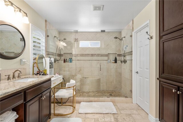 14131 Apple Grove Ct, Eastvale, CA 92880 - full bathroom featuring plenty of natural light, a shower stall, and vanity