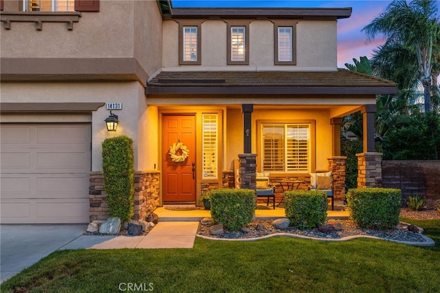 14131 Apple Grove Ct, Eastvale, CA 92880 - view of front facade with a porch, stucco siding, and stone siding