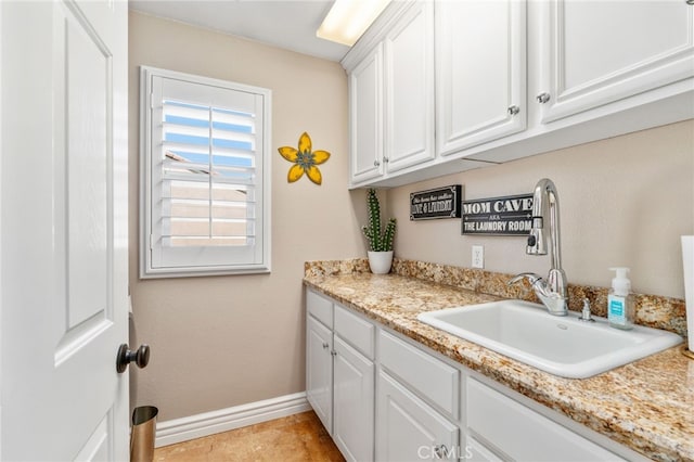 14131 Apple Grove Ct, Eastvale, CA 92880 - washroom with a sink and baseboards