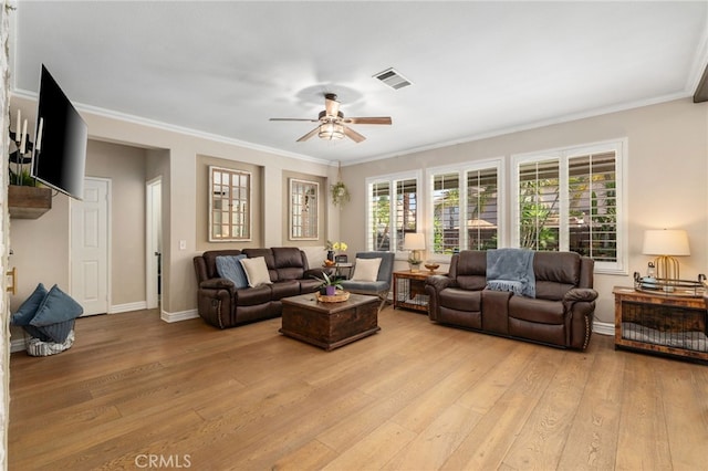 14131 Apple Grove Ct, Eastvale, CA 92880 - living room featuring light wood-style flooring, a ceiling fan, and ornamental molding