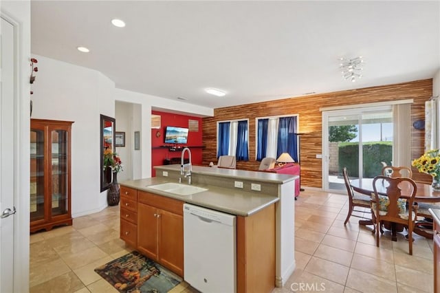 1627 Camino Sueno, Hemet, CA 92545 - kitchen with dishwasher, open floor plan, a center island with sink, light tile patterned floors, and light countertops