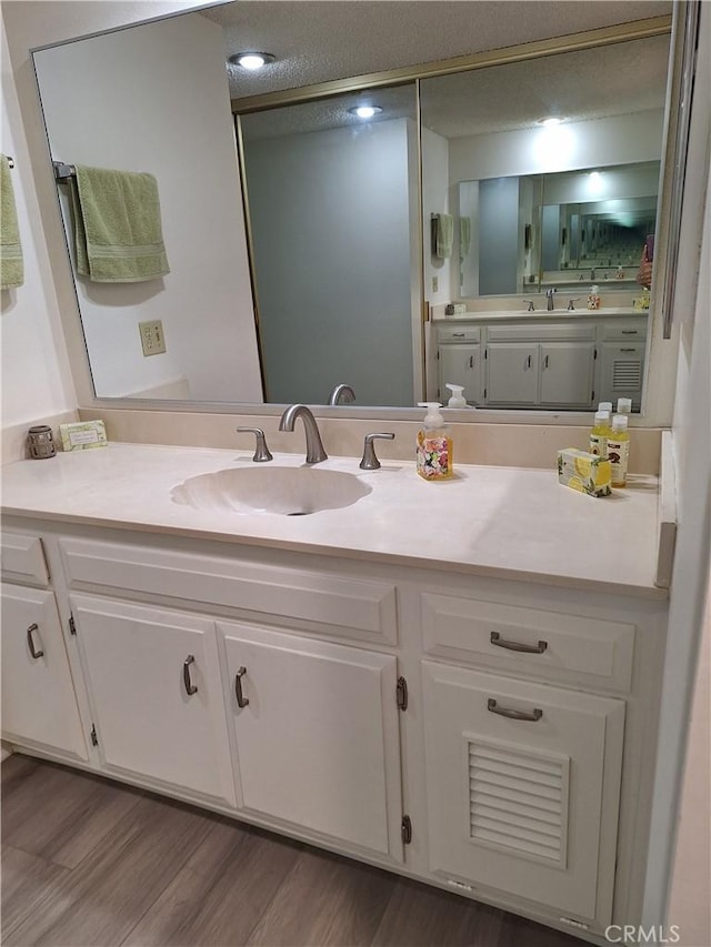 3144 Via Vis Unit Q, Laguna Woods, CA 92637 - bathroom featuring vanity and wood finished floors