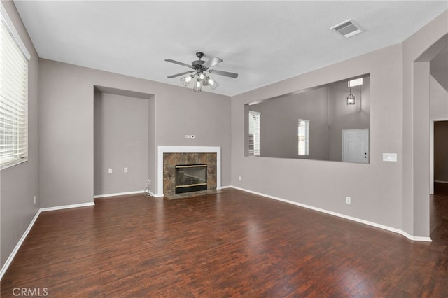 11890 Greenbluff Way, Yucaipa, CA 92399 - unfurnished living room with plenty of natural light, ceiling fan, a fireplace, and wood finished floors