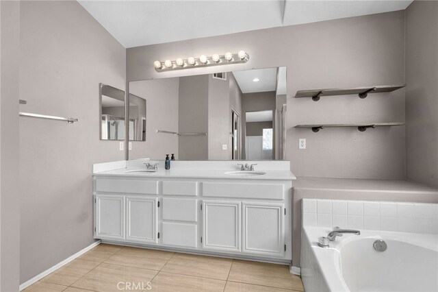 11890 Greenbluff Way, Yucaipa, CA 92399 - bathroom with double vanity, a garden tub, and tile patterned floors