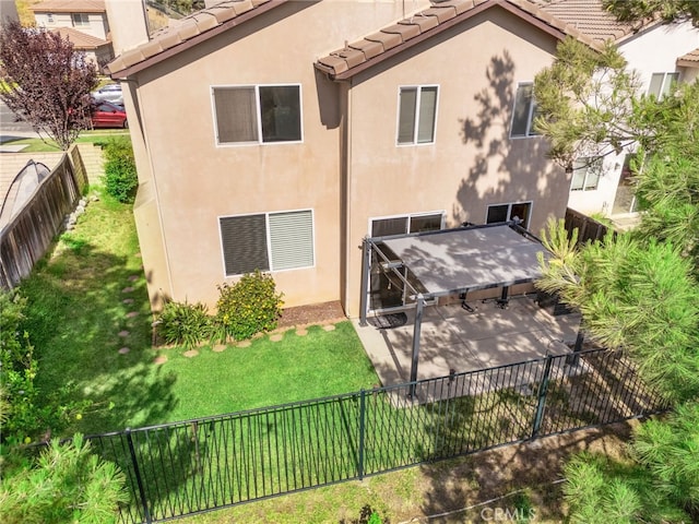 11890 Greenbluff Way, Yucaipa, CA 92399 - back of property featuring a fenced backyard, stucco siding, a patio, and a tile roof