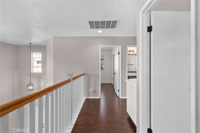 11890 Greenbluff Way, Yucaipa, CA 92399 - hallway featuring dark wood-style flooring, an upstairs landing, and recessed lighting