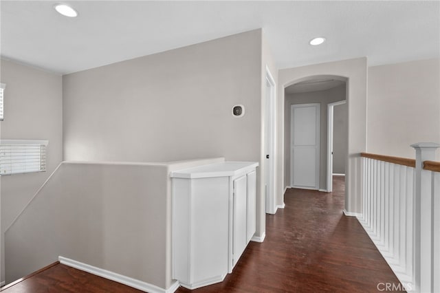 11890 Greenbluff Way, Yucaipa, CA 92399 - hallway featuring an upstairs landing, arched walkways, dark wood finished floors, and recessed lighting