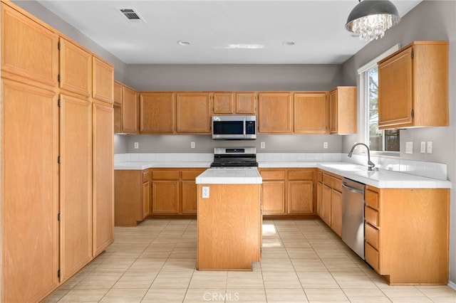 11890 Greenbluff Way, Yucaipa, CA 92399 - kitchen featuring stainless steel appliances, a kitchen island, a chandelier, light tile patterned flooring, and recessed lighting