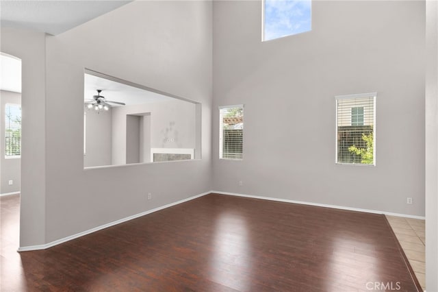 11890 Greenbluff Way, Yucaipa, CA 92399 - spare room featuring wood finished floors, a towering ceiling, and plenty of natural light
