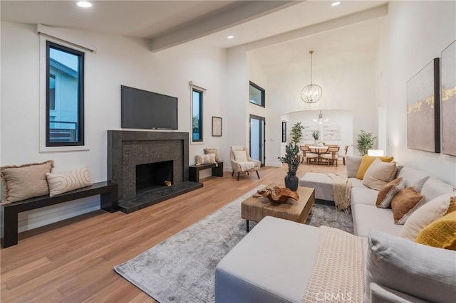 35 Beachcomber Dr, Corona Del Mar, CA 92625 - living room with wood finished floors, a chandelier, beam ceiling, recessed lighting, and a fireplace with raised hearth