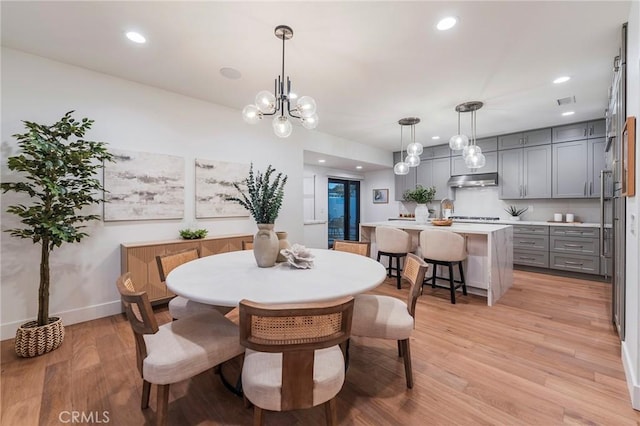 35 Beachcomber Dr, Corona Del Mar, CA 92625 - dining room featuring light wood finished floors, recessed lighting, and a chandelier