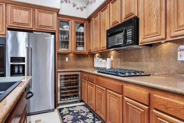 6130 Paseo Monona, Carlsbad, CA 92009 - kitchen featuring wine cooler, stainless steel appliances, brown cabinetry, and light countertops