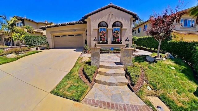 6130 Paseo Monona, Carlsbad, CA 92009 - mediterranean / spanish house featuring stucco siding, a tile roof, a garage, and driveway