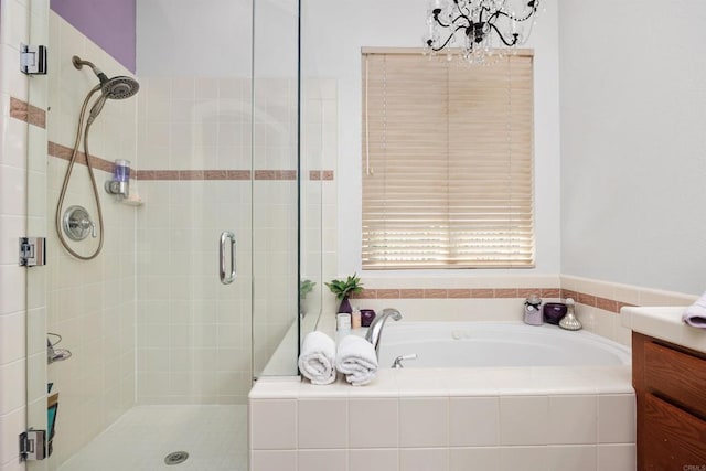 6130 Paseo Monona, Carlsbad, CA 92009 - bathroom with a chandelier, a shower stall, a garden tub, and vanity