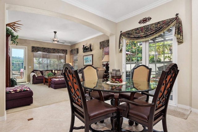 6130 Paseo Monona, Carlsbad, CA 92009 - carpeted dining area with arched walkways, ceiling fan, ornamental molding, and tile patterned flooring