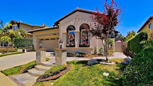 6130 Paseo Monona, Carlsbad, CA 92009 - mediterranean / spanish-style house featuring stucco siding, driveway, a garage, and a tiled roof