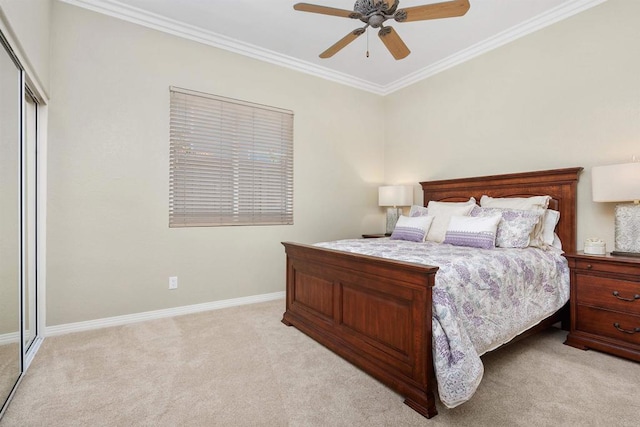 6130 Paseo Monona, Carlsbad, CA 92009 - bedroom with light carpet, ornamental molding, a closet, and a ceiling fan