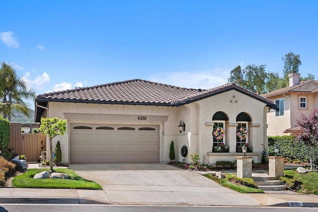 6130 Paseo Monona, Carlsbad, CA 92009 - mediterranean / spanish house featuring a garage, stucco siding, driveway, and a tiled roof