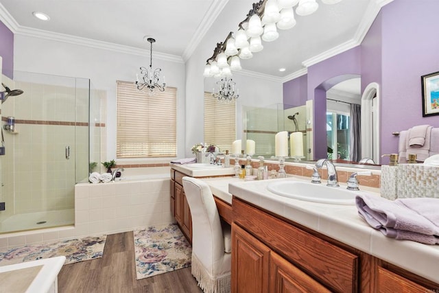 6130 Paseo Monona, Carlsbad, CA 92009 - bathroom with double vanity, a shower stall, wood finished floors, a garden tub, and a chandelier