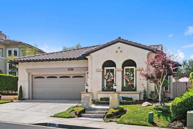 6130 Paseo Monona, Carlsbad, CA 92009 - mediterranean / spanish home with a tile roof, stucco siding, and concrete driveway