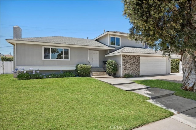 18643 Las Flores St, Fountain Valley, CA 92708 - split level home with a chimney, a garage, and driveway