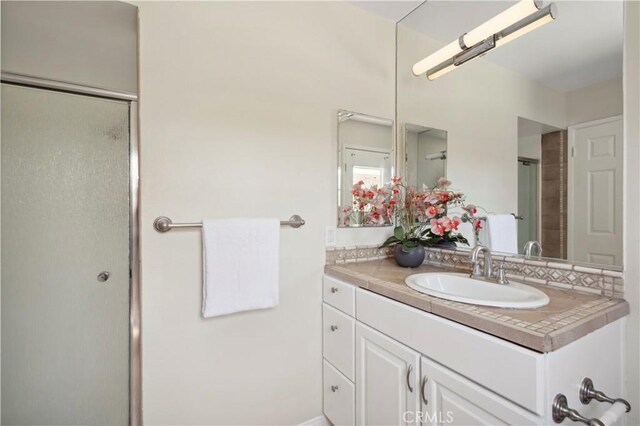 18643 Las Flores St, Fountain Valley, CA 92708 - bathroom with vanity and a shower with door