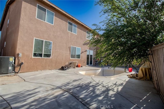 13740 Starshine Dr, Victorville, CA 92392 - back of house featuring stucco siding and a patio area