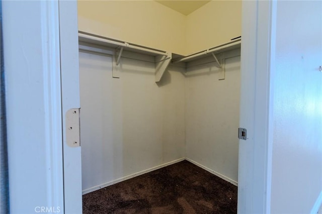 13740 Starshine Dr, Victorville, CA 92392 - walk in closet featuring dark carpet