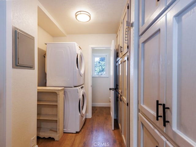 7491 Kingsbury Rd, Templeton, CA 93465 - washroom featuring stacked washer and clothes dryer and wood finished floors
