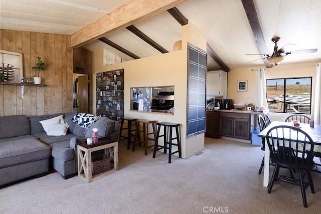 7491 Kingsbury Rd, Templeton, CA 93465 - living area featuring ceiling fan, light colored carpet, and wood walls