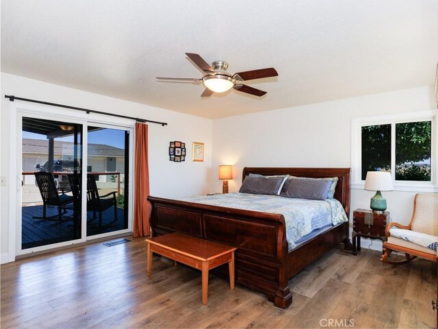 7491 Kingsbury Rd, Templeton, CA 93465 - bedroom featuring multiple windows, wood finished floors, access to exterior, and ceiling fan