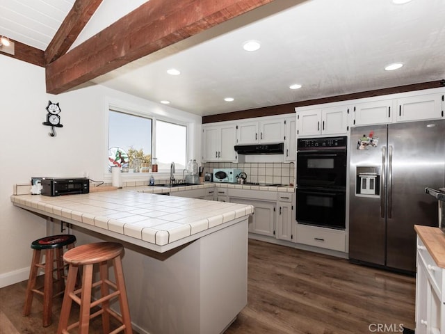 7491 Kingsbury Rd, Templeton, CA 93465 - kitchen with stainless steel appliances, a peninsula, white cabinetry, and recessed lighting